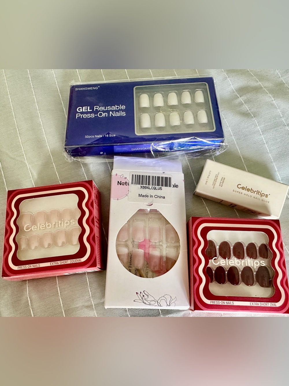 NWOT, never opened, four sets of nail and glue